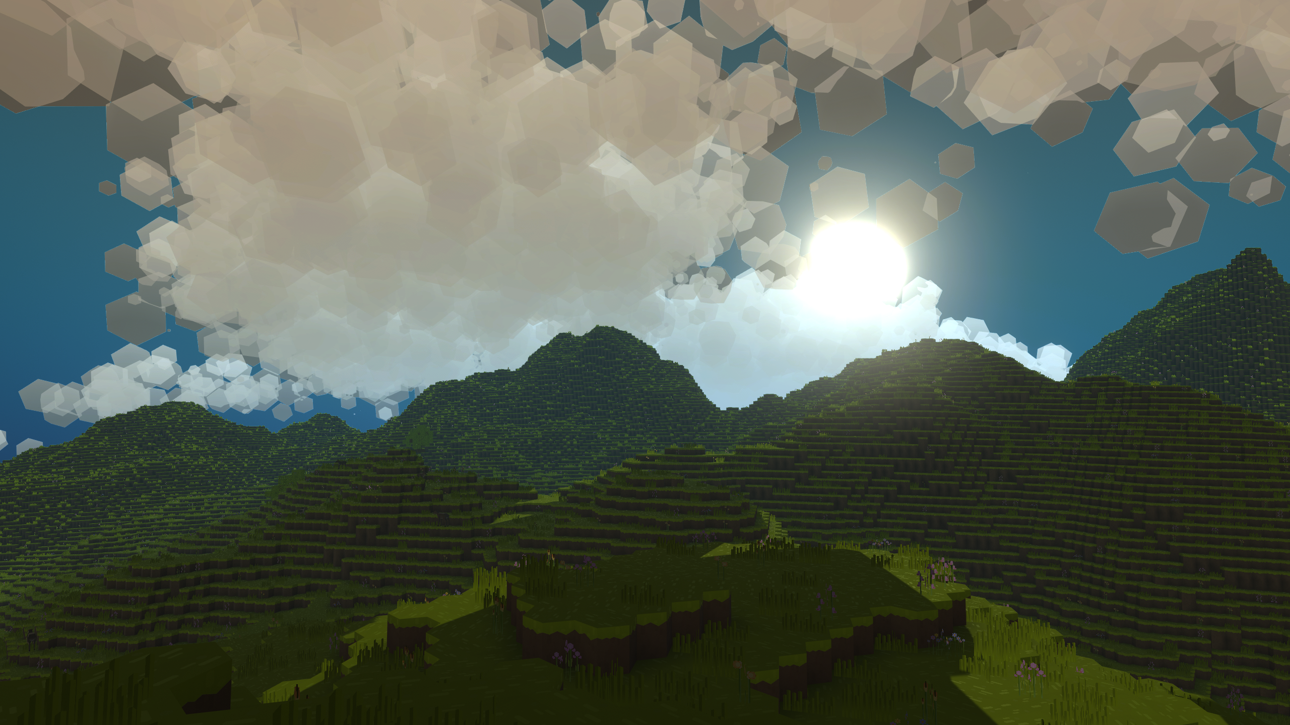 An image of PlanetSmith. title: Mountain Clouds, description: Sun shining through cloud above the mountains